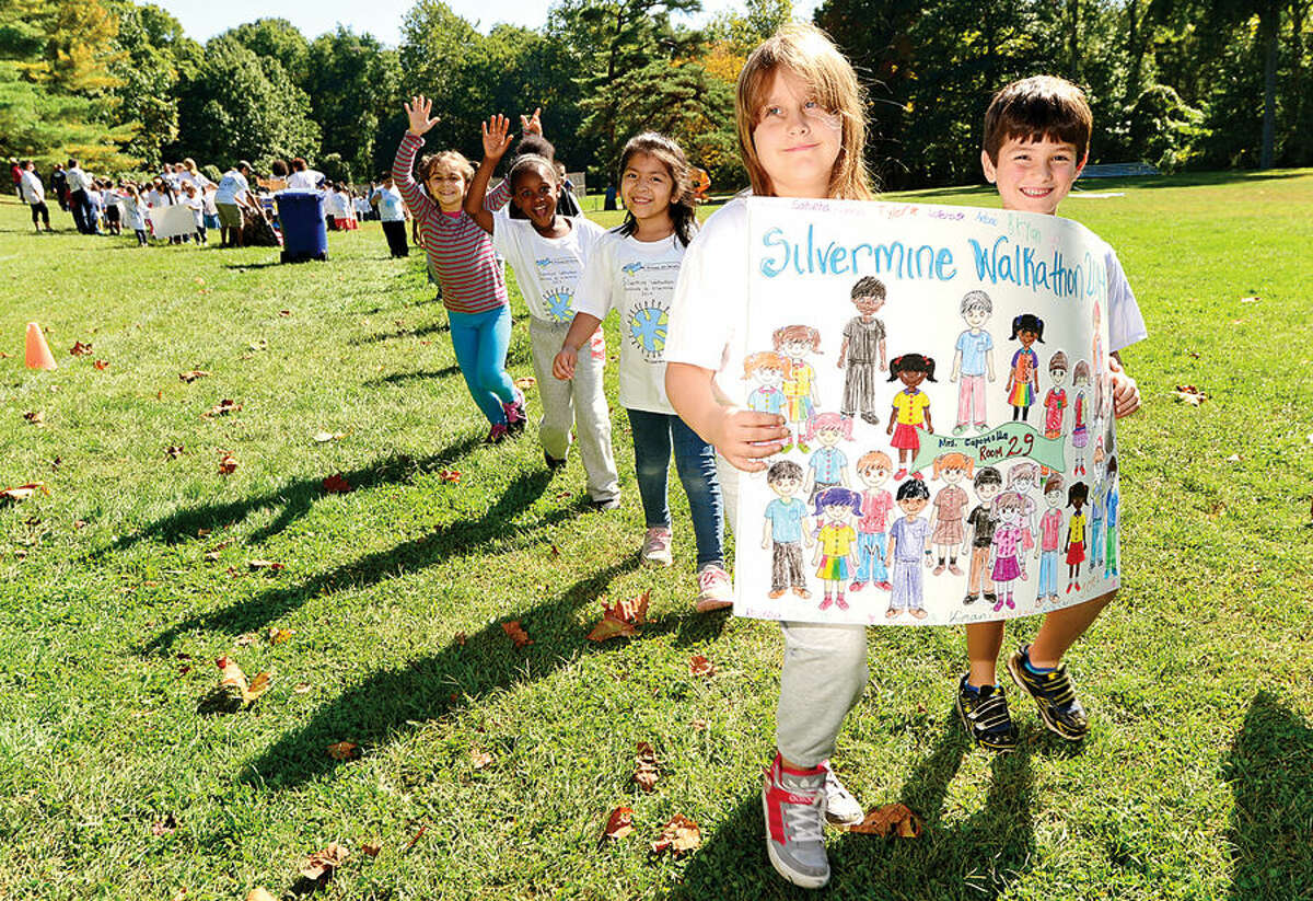 Hour photo / Erik Trautmann Silvermine Elementary School 2nd graders Giana Degroat and Tyler Quick participate in their annual walkathon Friday afternoon as part of their fundraising effort.