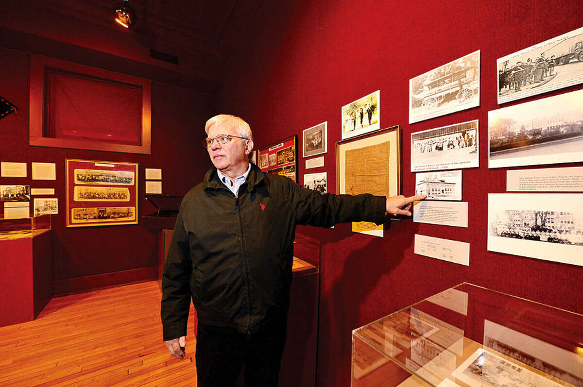Stamford Historical Society volunteer Dan Burke describes the new exhibit, “Stamford School Days: 1641-1971." The exhibit outlines the history of schools built in Stamford from the 1600s to present.