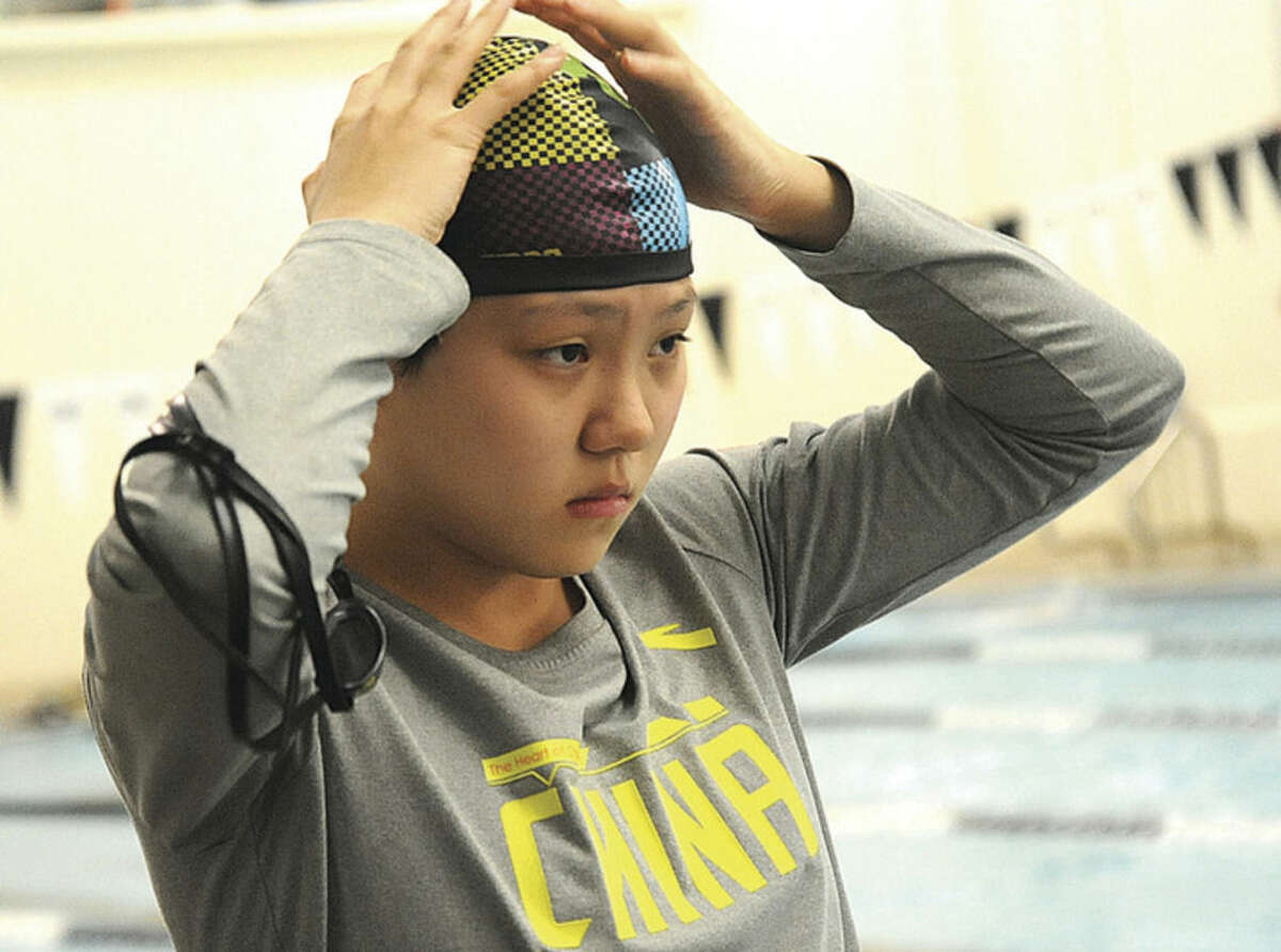 Hour photo/Matthew Vinci A member of the Chinese National Swim Team trains on Monday at Swim Seventy in Norwalk for the 2016 Rio Summer Olympics.