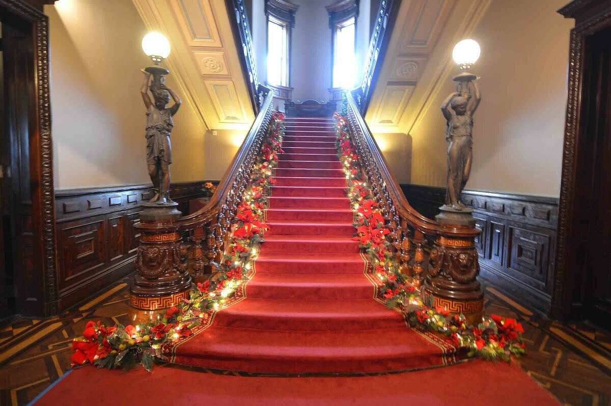 Hour Photo/Alex von Kleydorff The staircase is lighted for the new exhibit, Holiday Grandeur: The Mansion's toys and trains story at Lockwood Mathews Mansion Museum