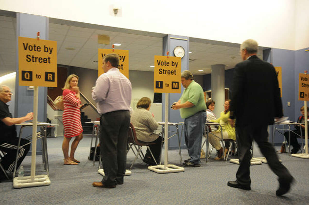 Wilton residents sign in at the Miller-Driscoll renovation project meeting at The Clune Center in Wilton. 