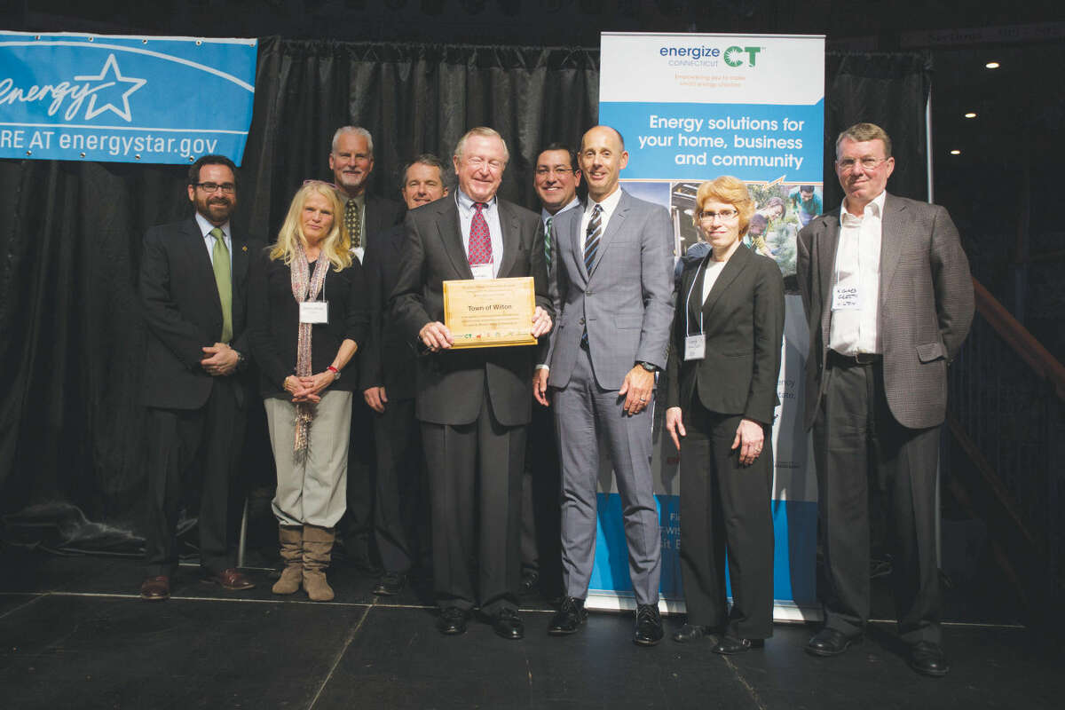 Former First Selectman Bill Brennan accepts the Clean Energy Communities Award.