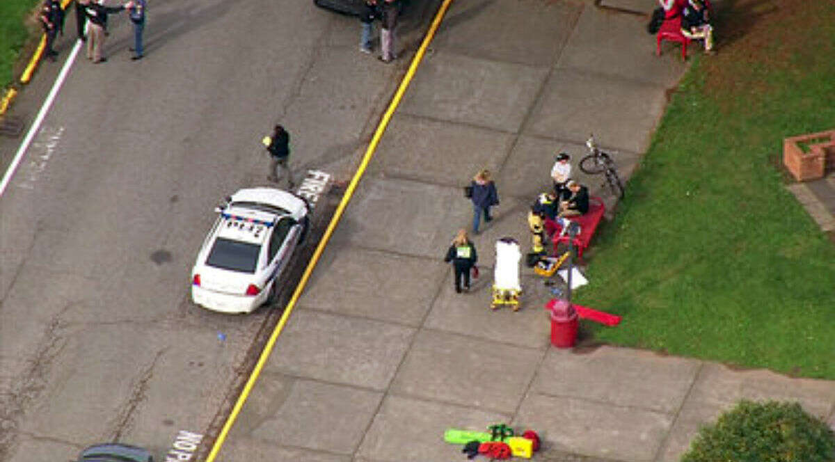 This image made from a video provided by KOMO shows emergency personnel responding after reports of a shooting at Marysville-Pilchuck High School in Marysville, Wash., Friday, Oct. 24, 2014. (AP Photo/KOMONews.com) 