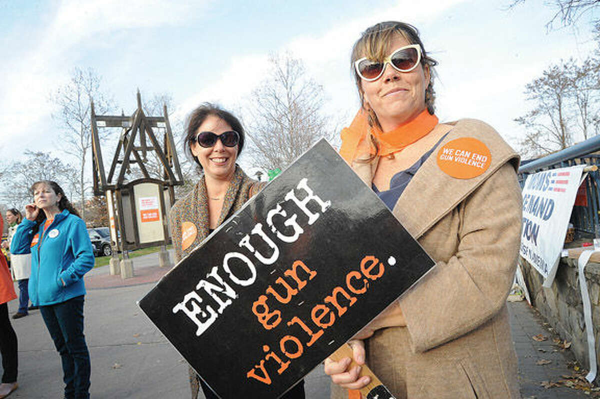 Jenny Butler and Christine McGee Sunday at Norwalk Oyster Shell Park to support the cause against gun violence. Hour photo/Matthew Vinci
