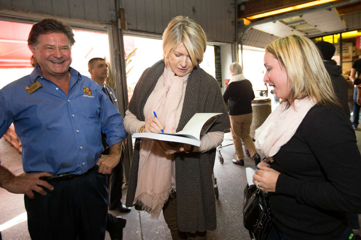 Hour photo / Chris Palermo. Martha Stewart signs a book for Kathleen White of Ithica, N.Y. after Stewart's book signing at Stew Leonard's Saturday.