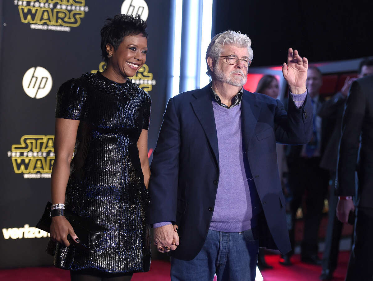 Mellody Hobson, left, and George Lucas arrive at the world premiere of "Star Wars: The Force Awakens" at the TCL Chinese Theatre on Monday, Dec. 14, 2015, in Los Angeles. (Photo by Jordan Strauss/Invision/AP)