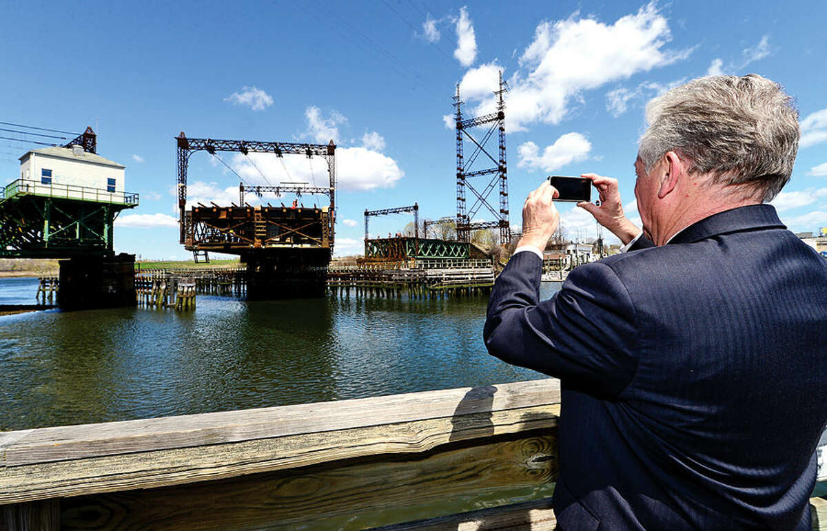 Hour photo / Erik Trautmann Local officials including Norwalk Mayor Harry Rilling witness the opening of the Walk Bridge during a press conference at the Maritime Aquarium Tuesday afternoon.