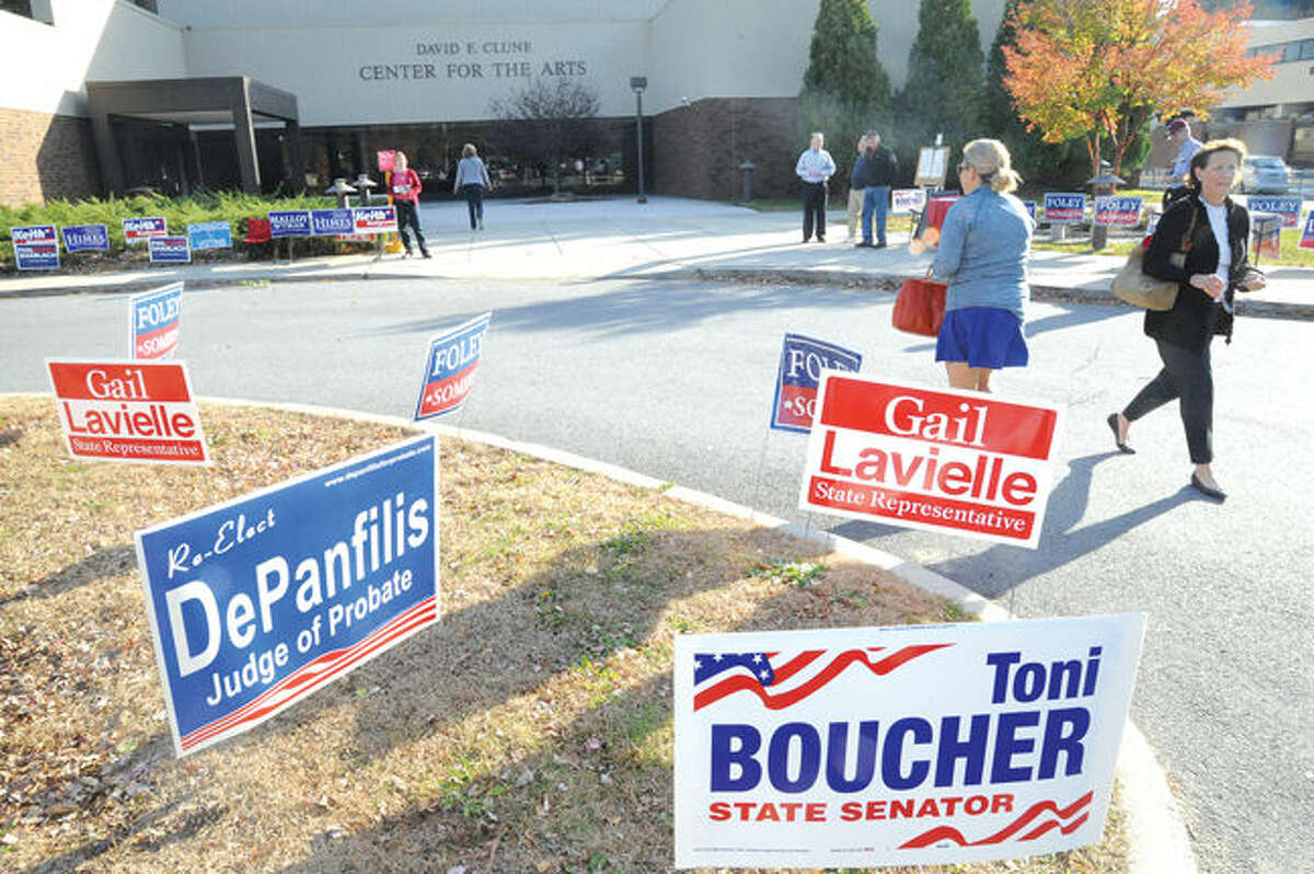 Residents in Wilton arrive at the Clune Center for the Arts at Wilton High School to cast ballots on Tuesday. Photo/Matthew Vinci