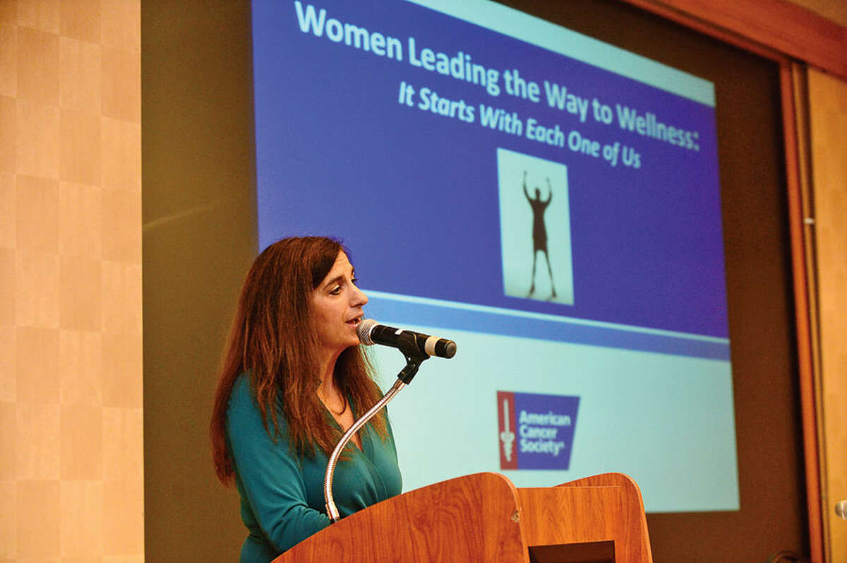 Hour photo / Erik Trautmann Health and Wellness Life Coach Nina Antolino welcomes guests as The American Cancer Society hosts the inaugural “Women Leading the Way to Wellness Breakfast” Wednesday morning at Dolce Norwalk. Fairfield county residents, local business and community leaders, and health professionals gathered to learn more about cancer prevention and early detection.
