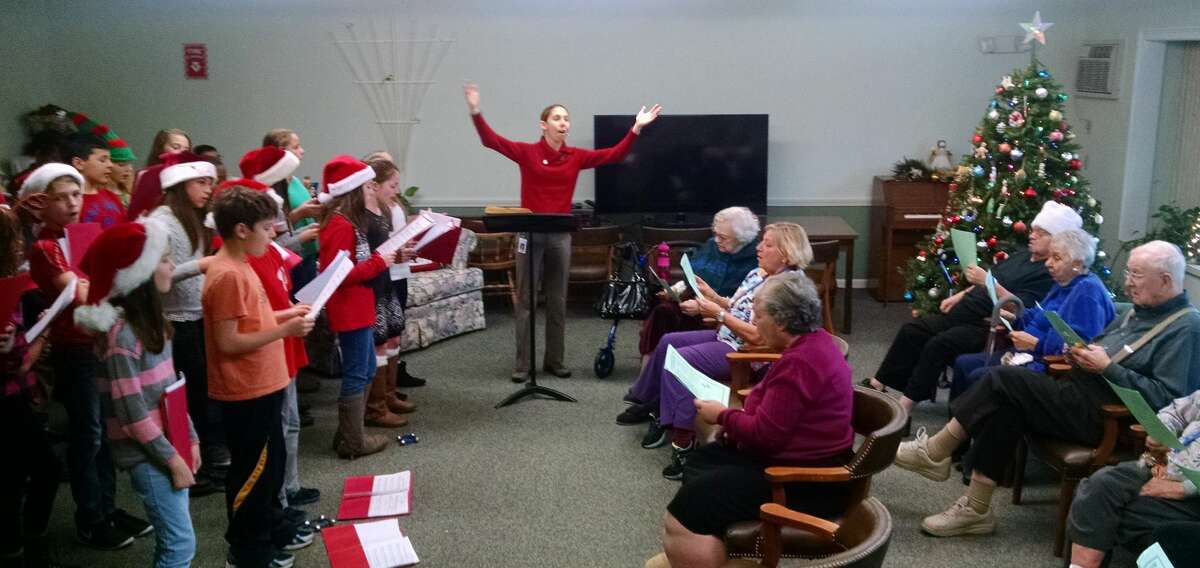 Students from the Squadron Line School Chorus performed on December 18th at a concert hosted by the residents of Belden Forest Court in Simsbury. Every year, the active residents make the season merry for local school children and community groups.