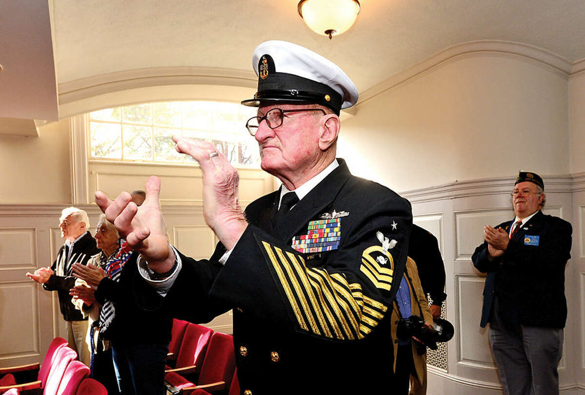 Hour photo / Erik Trautmann Navy Veteran Don Burrows applauds during the Norwalk Veteran's Day celebration at City Hall Tuesday morning.