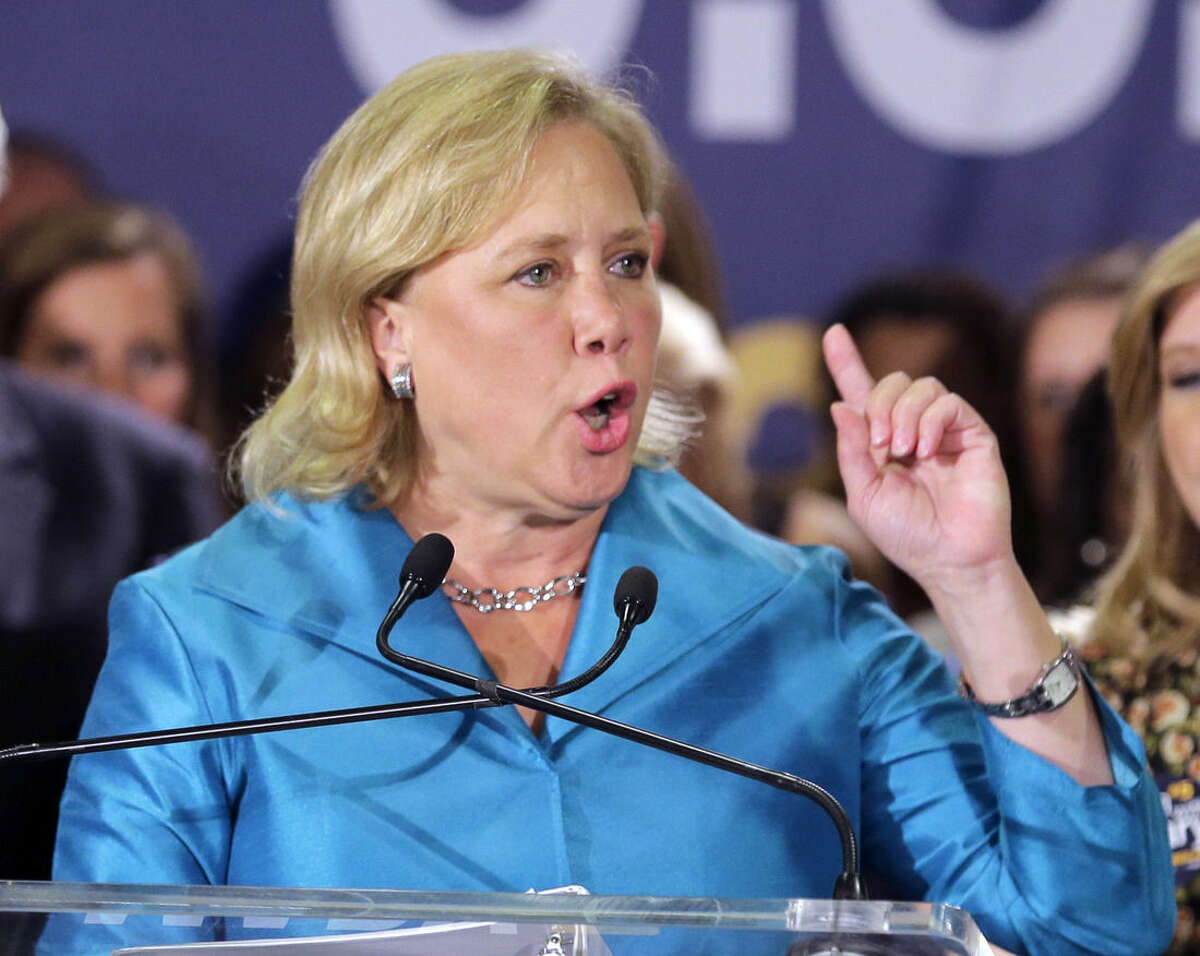 In this photo taken Nov. 4, 2014, Sen. Mary Landrieu, D-La., acknowledges supporters at her election night headquarters in New Orleans. Republicans have promised her Senate opponent Rep. Bill Cassidy a seat on the Senate's energy committee if he defeats Landrieu in the state's runoff election next month. The move undercuts one of Landrieu's chief campaign arguments, that voters in the state with a robust oil and gas industry need her and her seniority on the committee. (AP Photo/Bill Haber)