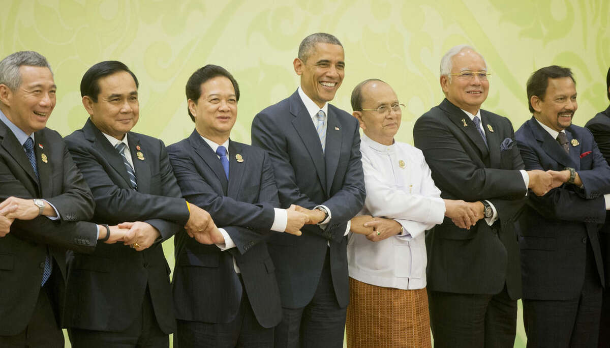 AP Photo/Pablo Martinez Monsivais U.S. President Barack Obama, center, shakes hands at the U.S.-ASEAN (Association of South East Asian Nations) meeting at the Myanmar International Convention Center, Thursday, Nov. 13, in Naypyitaw, Myanmar. With Obama are from left to right: Singaporean Prime Minister Lee Hsien Loong, Thailand Prime Minister Gen. Prayuth Chan-ocha; Vietnam Prime Minister Nguyen Tan Dung; Myanmar President Thein Sein; Malaysian Prime Minister Najib Razak; and Sultan of Brunei Hassanal Bolkiah.