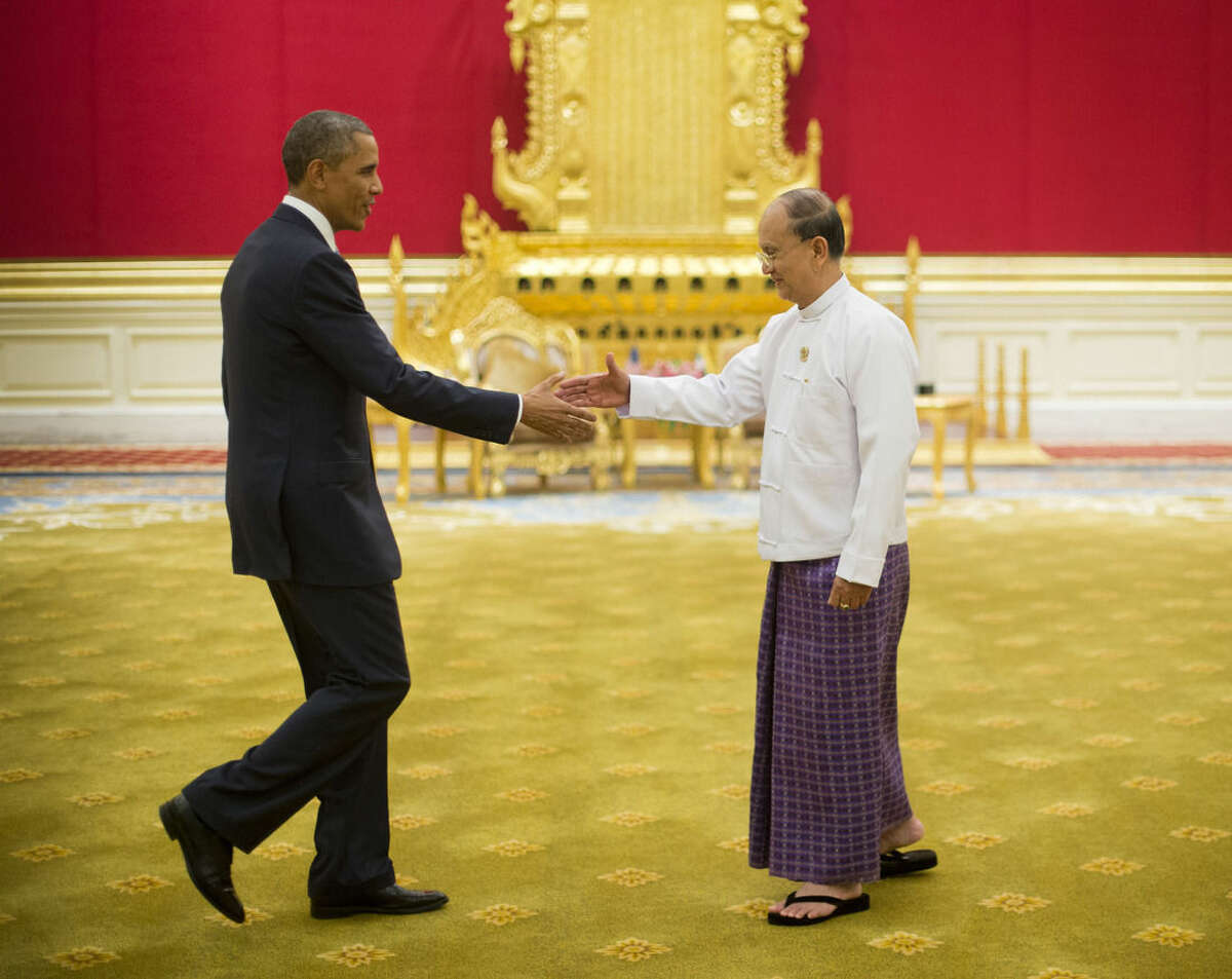 President Barack Obama reaches to shakes hands with Myanmar’s President Thein Sein, Thursday, Nov. 13, 2014, at the Presidential Palace in Naypyitaw, Myanmar. (AP Photo/Pablo Martinez Monsivais)