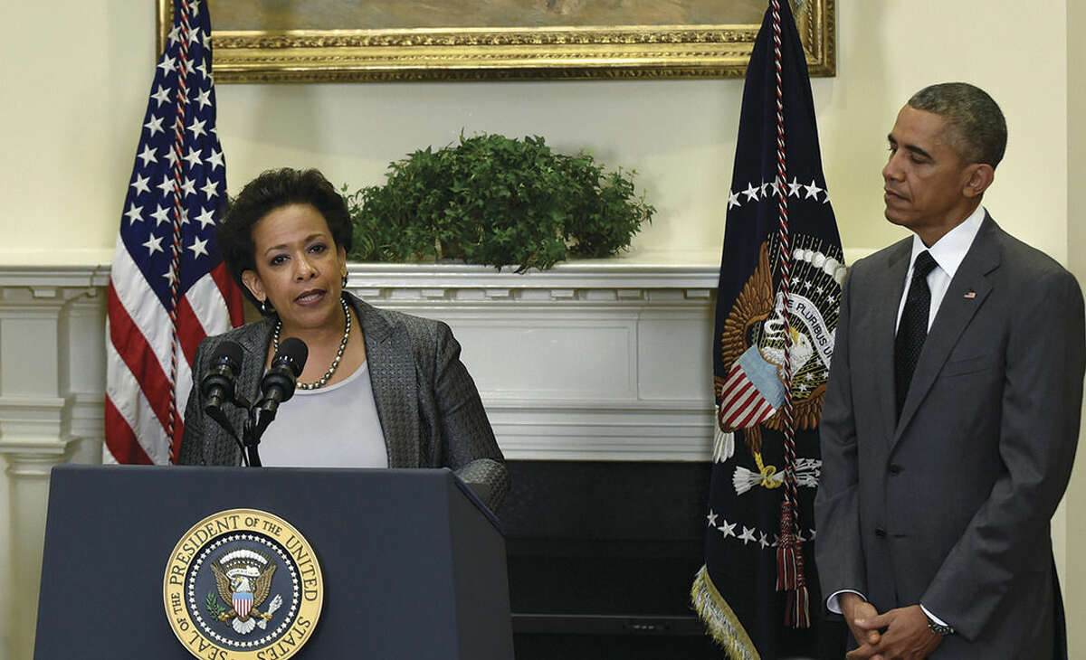 AP Photo/Susan Walsh President Barack Obama listens as U.S. Attorney Loretta Lynch speaks after Obama nominated Lynch to be the Attorney General Saturday, in the Roosevelt Room of the White House in Washington. Lynch would succeed Attorney General Eric Holder.