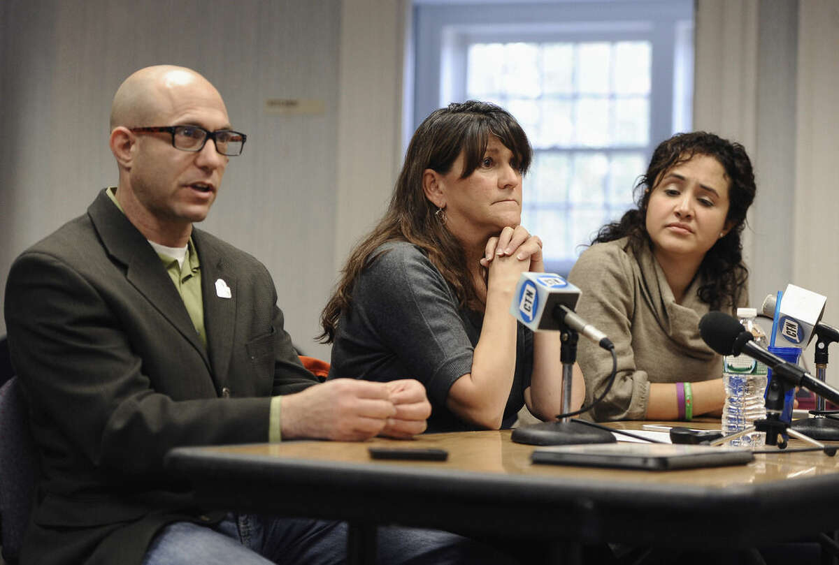 Jeremy Richman, left, and his wife Jennifer Hensel, center, parents of Sandy Hook Elementary school shooting victim Avielle Richman, and Nelba Marquez-Greene, right, mother of victim Ana Marquez-Greene address the Sandy Hook Advisory Commission, Friday, Nov. 14, 2014, in Newtown, Conn. The parents made presentations on ways to better address mental health, school safety and gun violence prevention. (AP Photo/Jessica Hill)