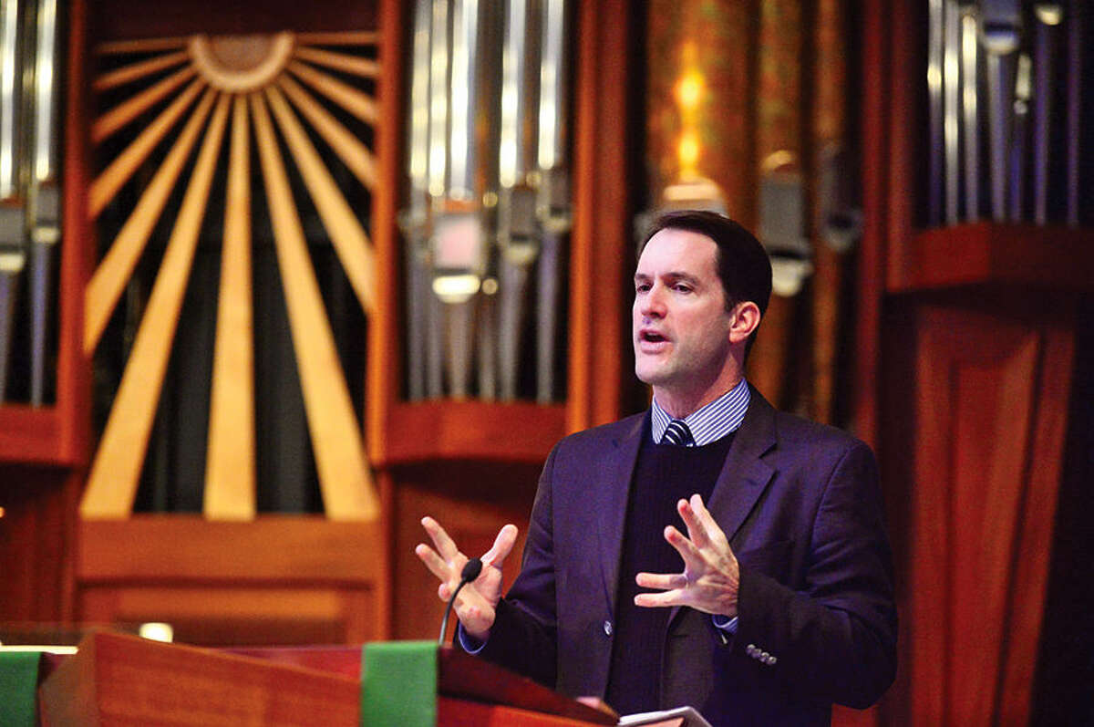 Hour photo / Erik Trautmann U.S. Rep. Jim Himes discusses immigration reform with representatives from Presbyterian congregations in Connecticut, Rhode Island and Massachusetts at the First Presbyterian Church of Stamford.