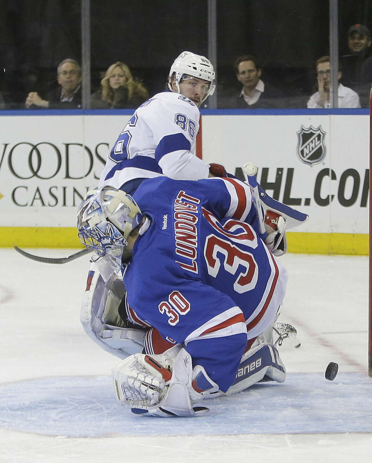 Tampa Bay Lightning's Nikita Kucherov (86), of Russia, scores on New York Rangers goalie Henrik Lundqvist (30), of Sweden, during the first period of an NHL hockey game Monday, Nov. 17, 2014, in New York. (AP Photo/Frank Franklin II)