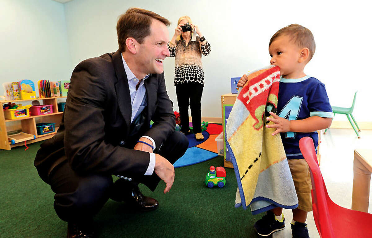 Hour photo / Erik Trautmann In this file photo, US Congressman Jim Himes meets with Joshua Juarez as he tours the Head Start program at Nathaniel Ely Elementary School to discuss his advocacy for Head Start and early education programs Friday morning.