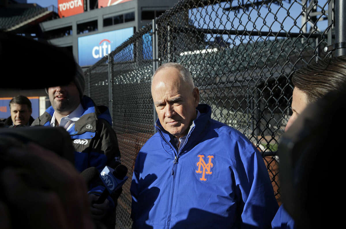 New York Mets general manager Sandy Alderson speaks to the media in the outfield of Citi Field in New York, Tuesday, Nov. 18, 2014. The Mets are moving their fences in at Citi Field for the second time. (AP Photo/Seth Wenig)