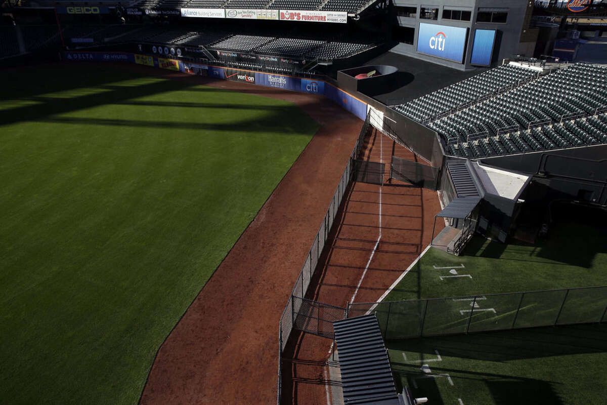 A white chalk line marks the location of the prior season's outfield wall at Citi Field in New York, Tuesday, Nov. 18, 2014. The Mets are moving their fences in at Citi Field for the second time. (AP Photo/Seth Wenig)