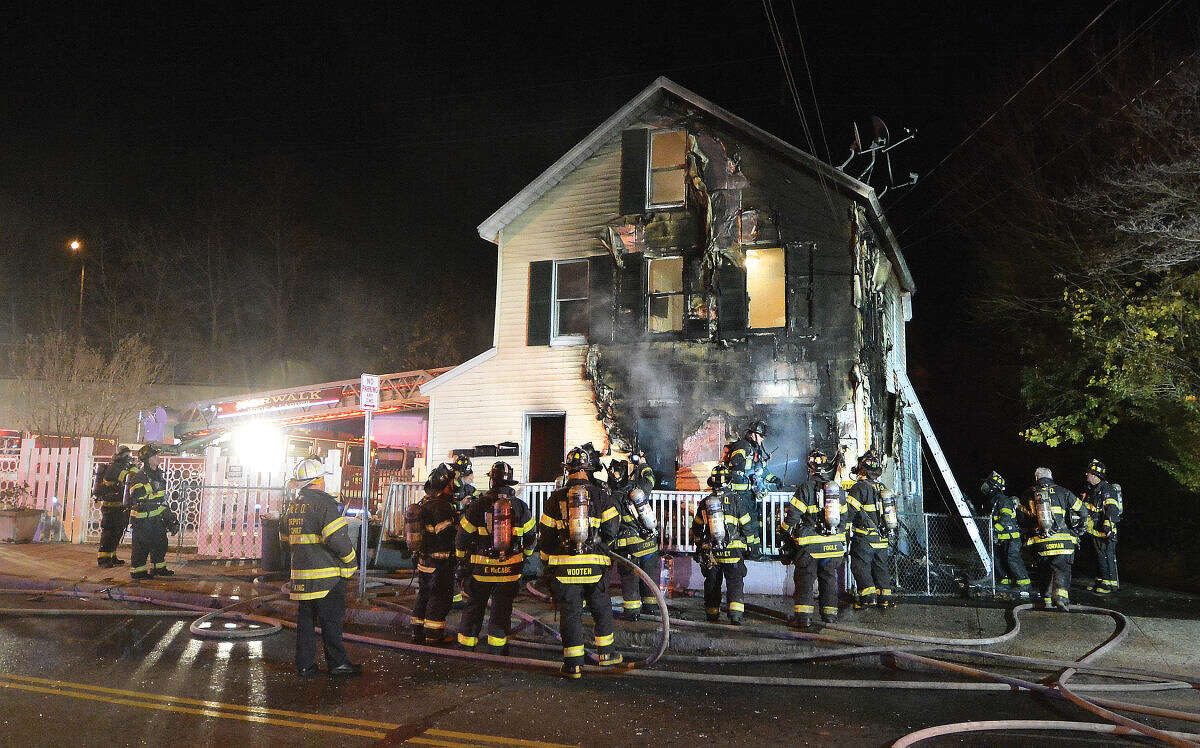Hour Photo/Alex von Kleydorff Firefighters respond to a house fire on Bouton Street at 6pm on Wednesday night