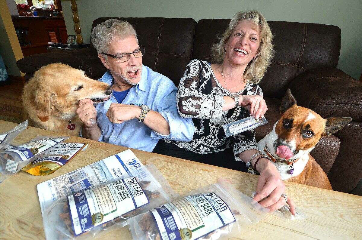 Wiltonians Anthony and Amanda Bennie created Clear Conscience Pet Co. and their dogs, Golden Ozzy and Potcake Taylor Bay, love the all-natural beef slider treats.