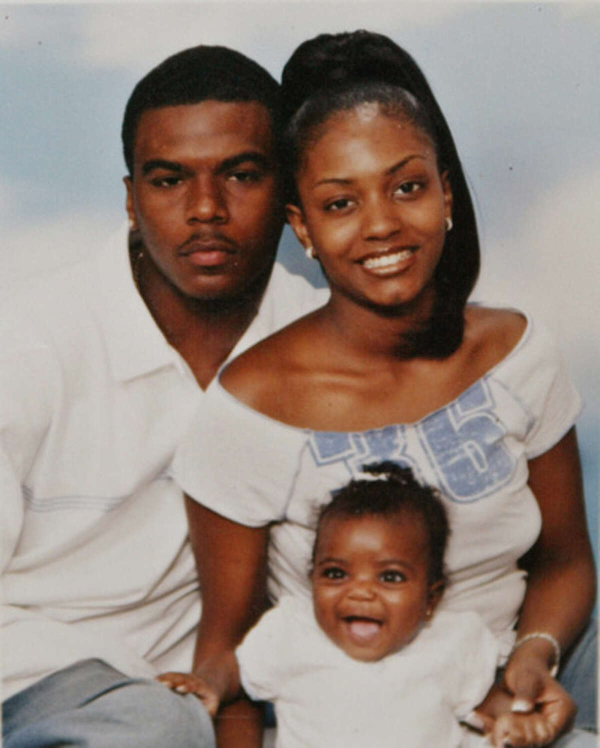 FILE - In this undated family file photo, Sean Bell and his fiancee Nicole Paultre pose with their daughter. Bell died in a hail of police gunfire on Nov. 25, 2006, as he left his bachelor party in the Queens borough of New York. Three detectives were acquitted of all charges in the shooting of Bell, who was unarmed. At least 400 people are killed by police officers in the United States every year, and while the circumstances of each case are different, one thing remains constant: In only a handful of instances do grand juries issue an indictment, concluding that the officer has committed a crime. (AP Photo/Family Photo via The Daily News, File)