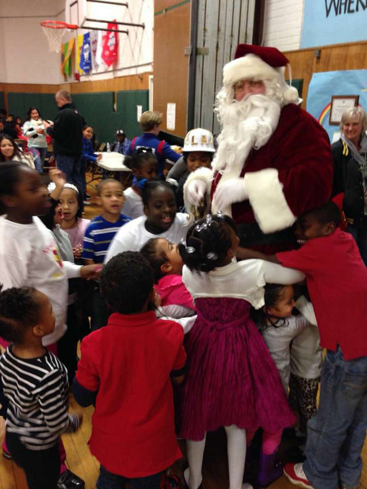 Contributed photo The Norwalk Police Athletic League held their annual holiday party Saturday at Columbus Magnet School.