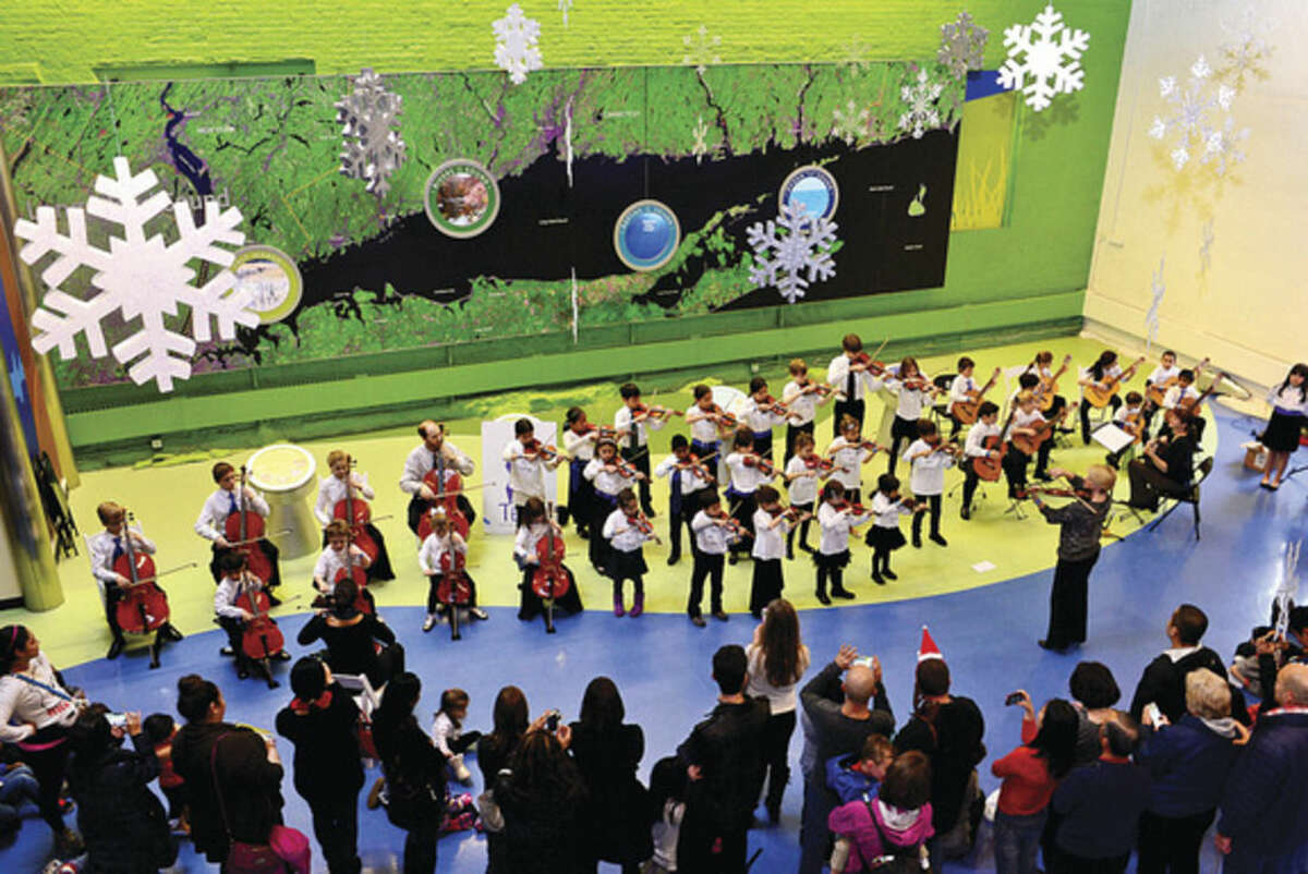 Hour photo/Erik Trautmann As part of the December music series at the Maritime Aquarium students of the Talent Education Suzuki School (TESS) Mixed Ensemble perform classical selections, including pieces by Bach, Giuliani and Paganini.