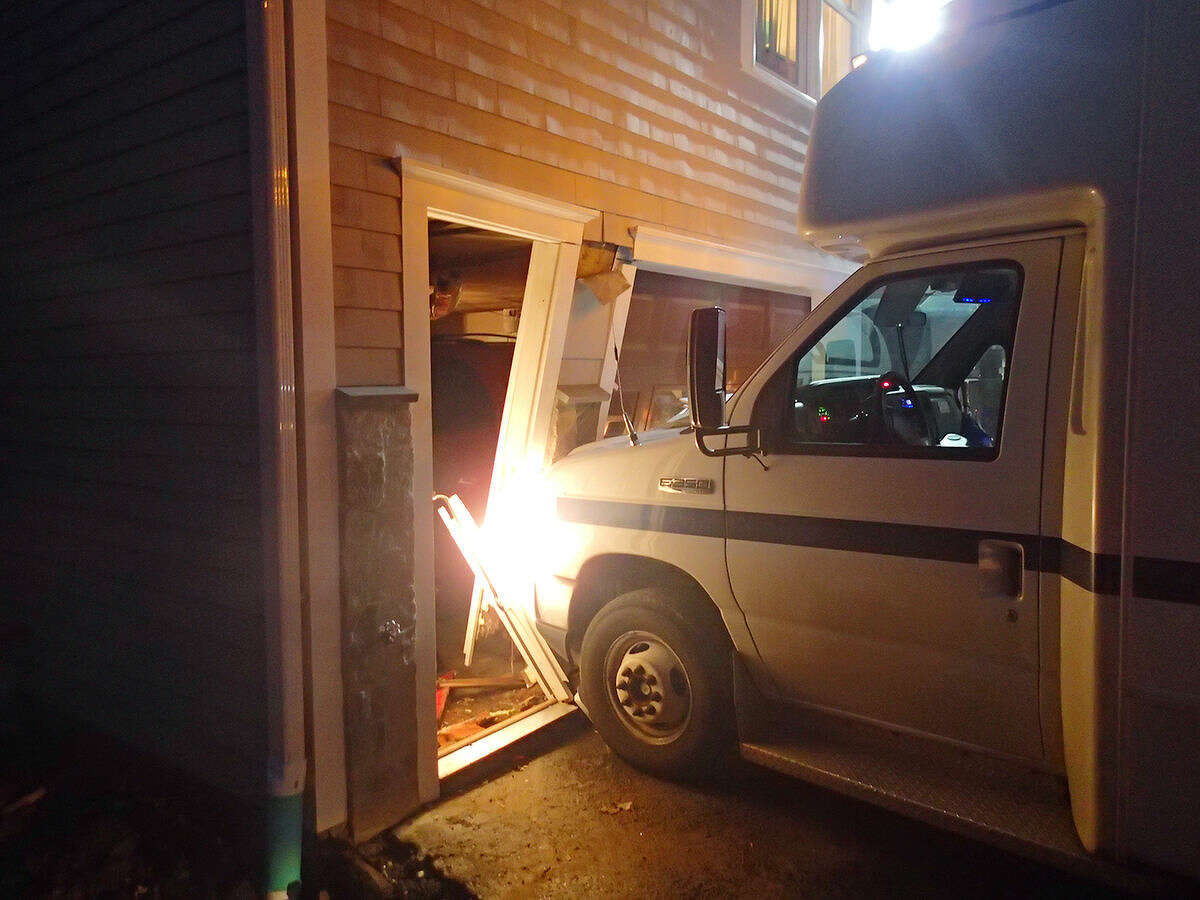 Contributed photo Westport Fire Department responds to a van that struck a residence on Terhune Drive Wednesday evening.
