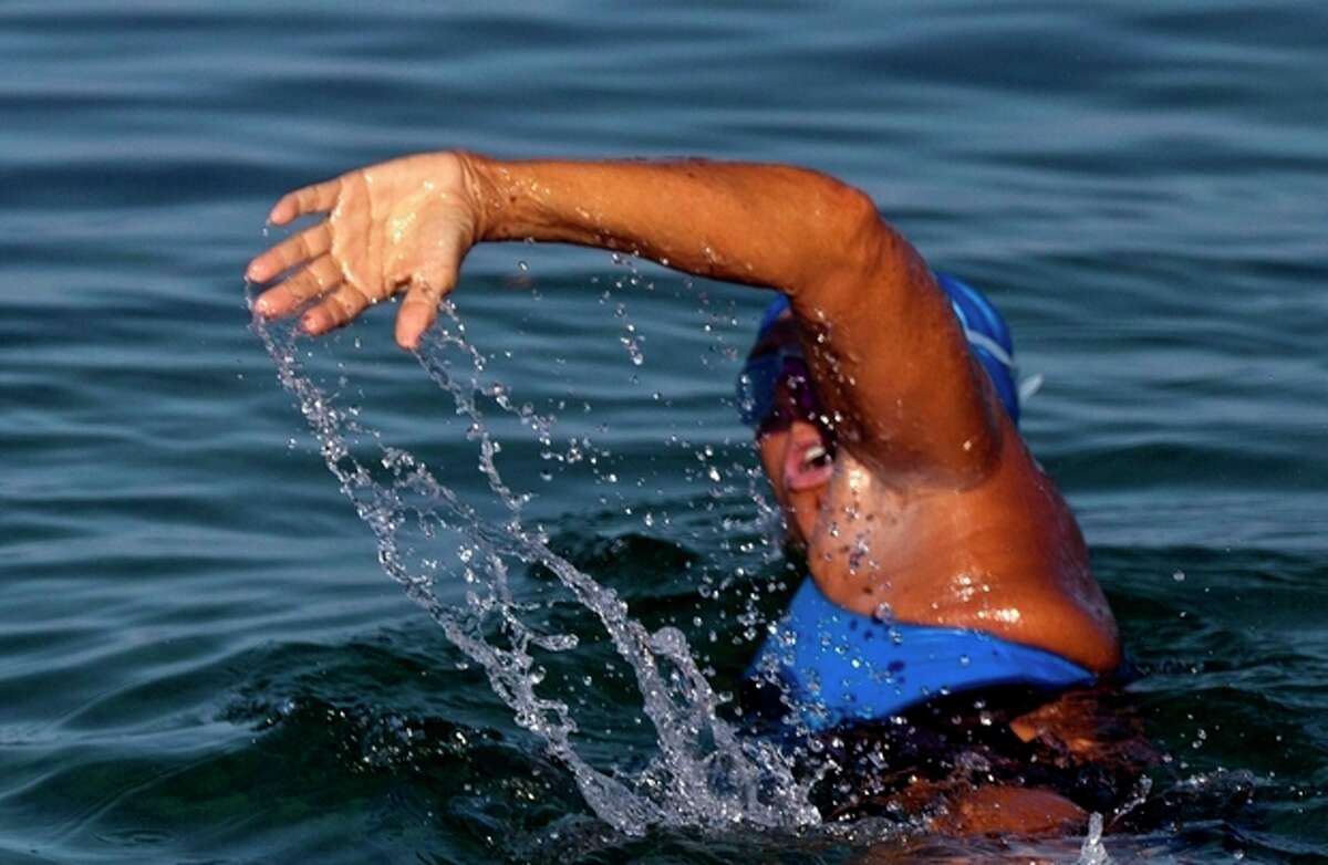 FILE - In a Saturday, Aug. 31, 2013 file photo, U.S. endurance swimmer Diana Nyad, 64, begins her swim to Florida from the waters off Havana, Cuba. Nyad's representatives said Monday, Sept. 2, 2013 that she's less than 10 miles (16 kilometers) from Florida in her latest attempt to swim there from Cuba. Nyad is trying to become the first person to swim from Cuba to Florida without a shark cage. (AP Photo/Ramon Espinosa, File)