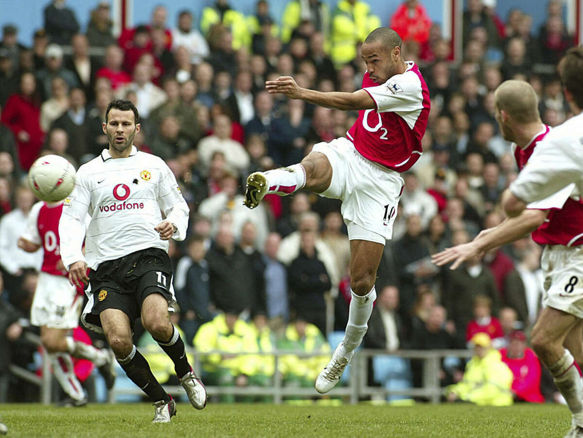FILE - In this Saturday April 3, 2004 file photo Arsenal's Thierry Henry, second from left, shoots for a goal minutes after he came on in the second half of the FA Cup semi-Final between Manchester United and Arsenal at Villa Park, Birmingham, England. Thierry Henry has announced his retirement following a 20-year career. The 37-year-old Henry, a member of the France teams that won the 1998 World Cup and 2000 European Championship, will take up a media role as a consultant for Sky Sports channel. (AP Photo/John D McHugh, File)
