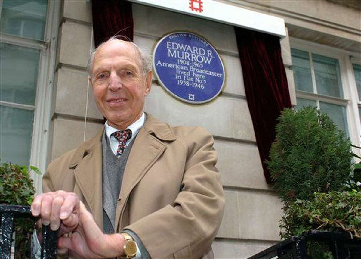 FILE - In this Feb. 15, 2006 file photo, An English Heritage Blue Plaque is unveiled for American broadcaster Edward R. Murrow by fellow reporter Richard C. Hottelet at Weymouth House, Hallam Street, in London, where he lived from 1938-1946 during the blitz. Hottelet, the last of the original "Murrow's Boys," the pioneering group of wartime journalists hired by CBS radio newsman Edward R. Murrow, has died. He was 97. CBS News spokesman Kevin Tedesco said Wednesday, Dec. 17, 2014, that Hottelet died Tuesday night, Dec. 16, at his home in Connecticut.