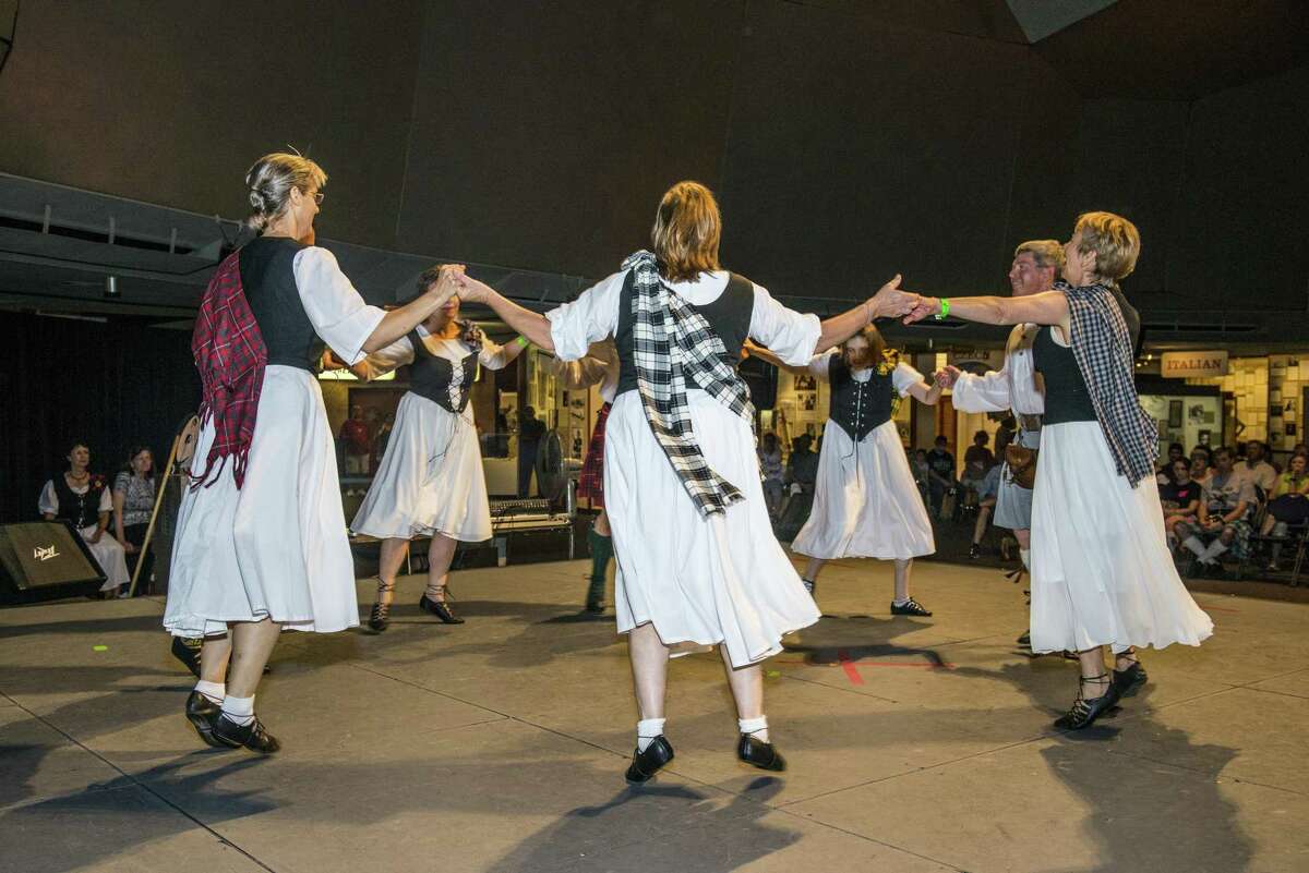 The Bluebonnet Scottish Country Dancers perform during the 45th annual Folklife Festival at UTSA HemisFair Park on June 12.
