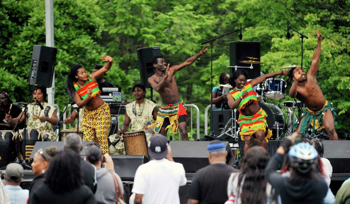 Members of the Tsoloi Ensemble perform a traditional African dance at the Juneteenth celebration at Washington Park on Sunday, June 12, 2016, in Albany, N.Y. Juneteenth has long been a celebration of freedom, as the date represents the time when the last slaves in America were freed after emancipation. (Paul Buckowski / Times Union)