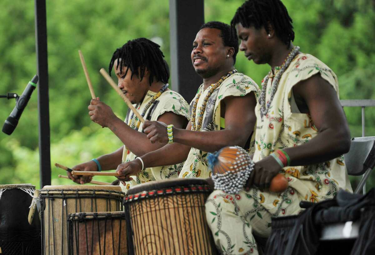 Members of the Tsoloi Ensemble perform a traditional African dance at the Juneteenth celebration at Washington Park on Sunday, June 12, 2016, in Albany, N.Y. Juneteenth has long been a celebration of freedom, as the date represents the time when the last slaves in America were freed after emancipation. (Paul Buckowski / Times Union)