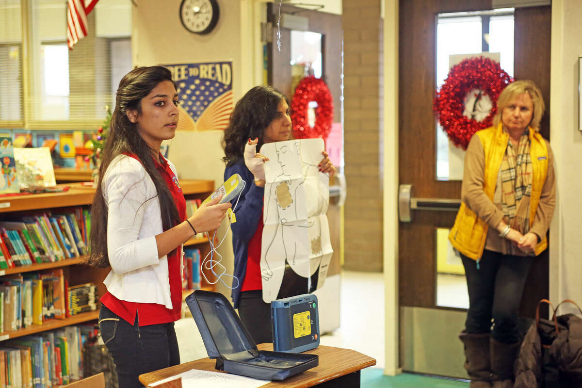 Mahika Jhangiani, a senior at Norwalk High School, gives a CPR class at Marvin Elementary School Monday afternoon as a part of her Project Explore senior project. Hour Photo / Danielle Calloway