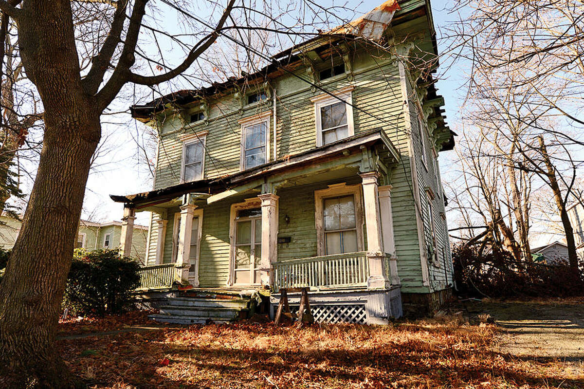 Hour photo / Erik Trautmann A run down Victorian era home at 61 Osborne Ave. There are sixty Norwalk properties cited under city’s blight ordinance. Members of Common Council’s Ordinance Committee are discussing strengthening the ordinance.
