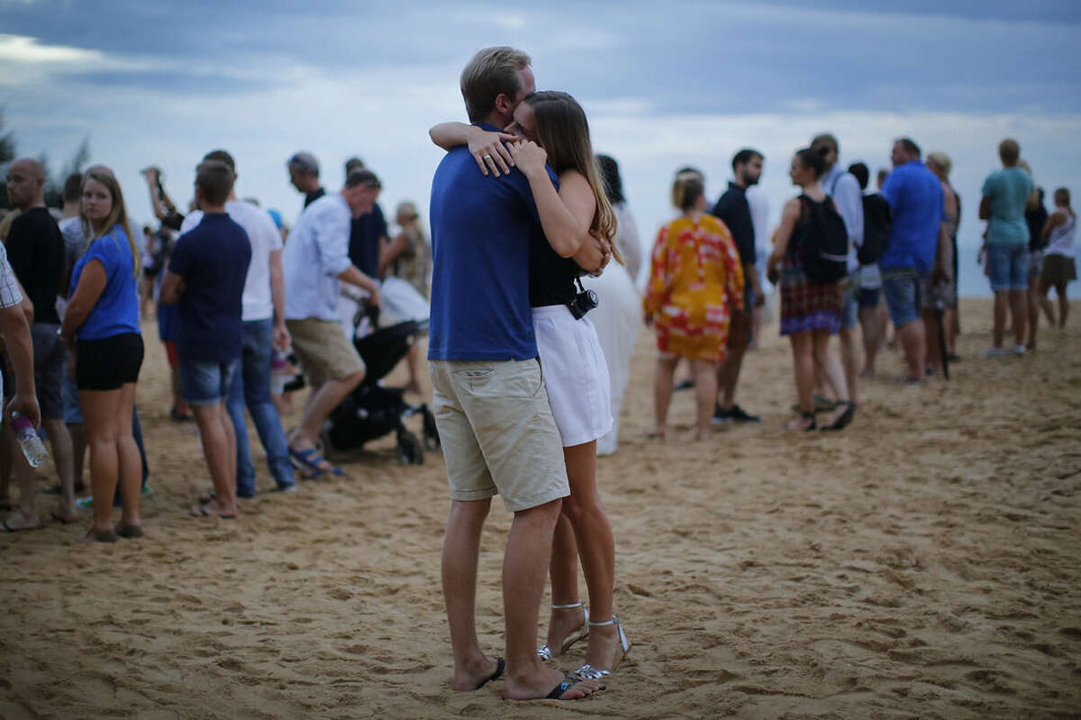 A couple embrace during a commemoration ceremony for the Swedish victims of the Asian tsunami, Friday, Dec. 26, 2014 in Khao Lak, Thailand. Dec. 26 marks the 10th anniversary of one of the deadliest natural disasters in world history: a tsunami, triggered by a massive earthquake off the Indonesian coast, that left more than 230,000 people dead in 14 countries and caused about $10 billion in damage. (AP Photo/Wong Maye-E)