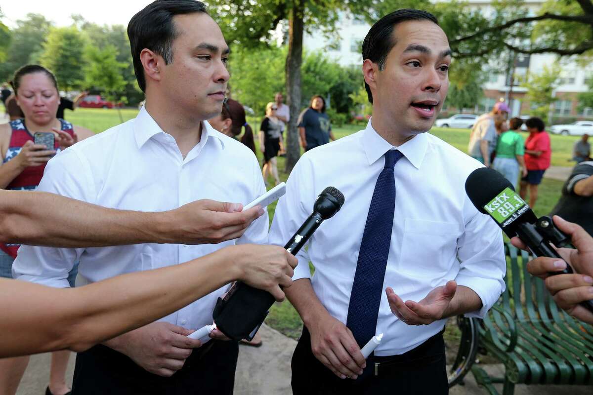 U.S. Rep. Joaquin Castro, D-San Antonio, (left) and his twin brother Secretary of Housing and Urban Development and former San Antonio mayor Julian Castro answer questions from the media after a vigil for the Orlando, Fla. shooting held Sunday June 12, 2016 at Crockett Park. About 300 people attended the vigil.