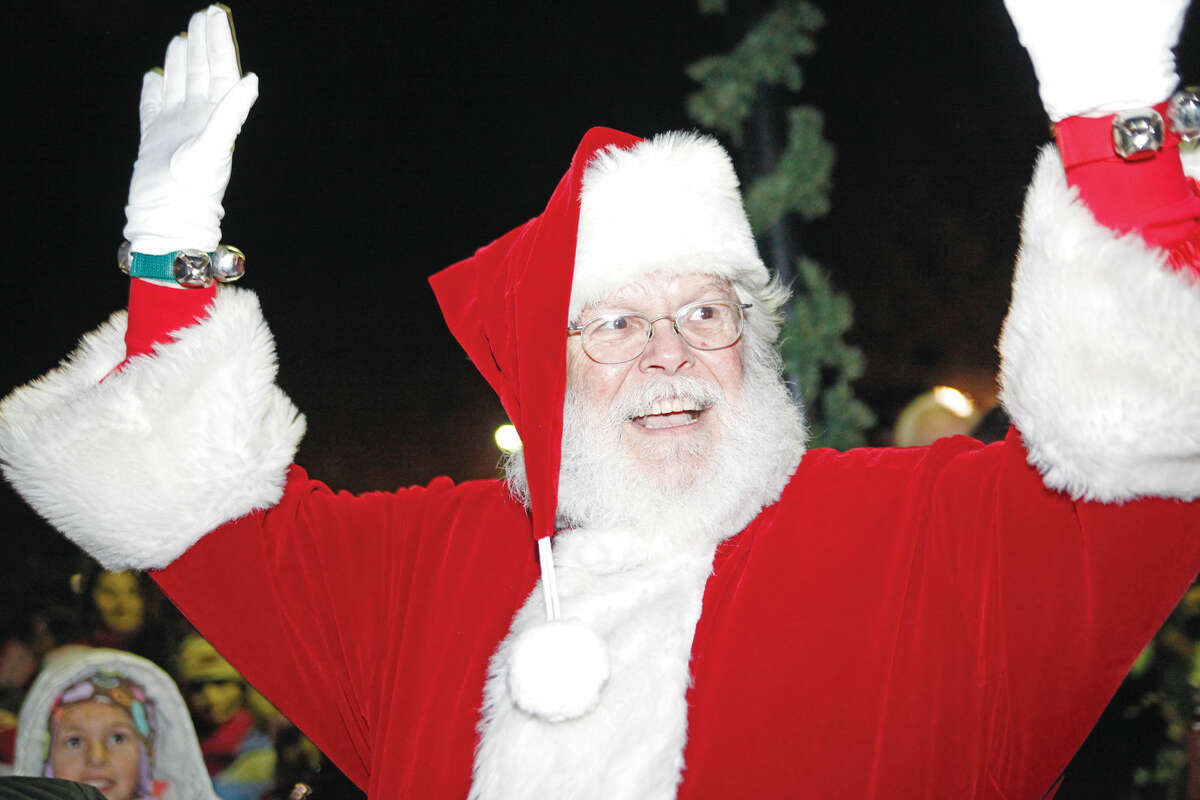 Santa Claus arrives during the annual Wilton tree lighting and Holiday Stroll in these file photos from 2011. 