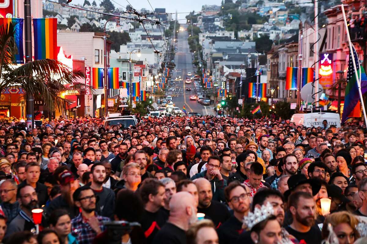 Hundreds of people gather during a vigil to honor the victims of the Orlando massacre, in San Francisco, California, on Sunday, June 12, 2016.
