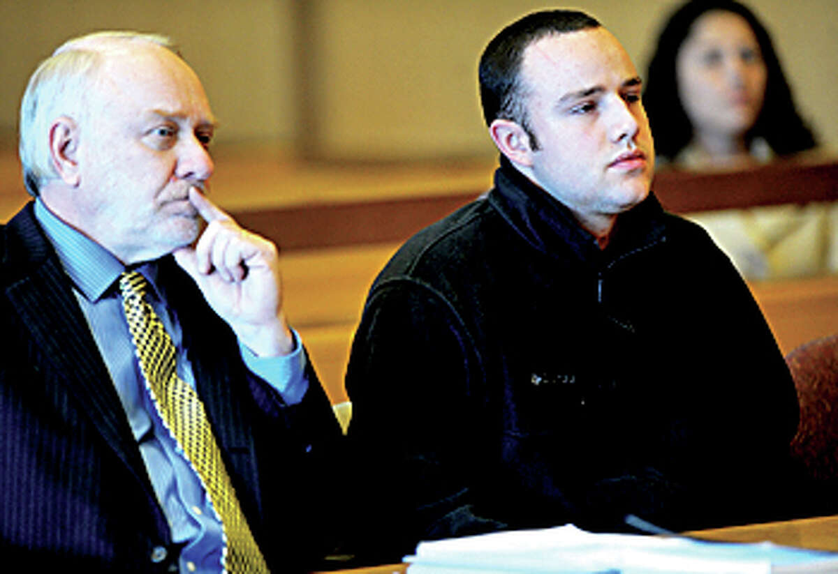 Aaron Ramsey of Wilton, right, sits beside his lawyer, Howard Ehring, left, as Ramsey is found not guilty by reason of mental disease or deficiency by a three-judge panel during a verdict reading at state Superior Court in Stamford on Wednesday, December 12, 2012. Ramsey was on trial for beating his father, Edward, to death in May after Ramsey allegedly heard voices.