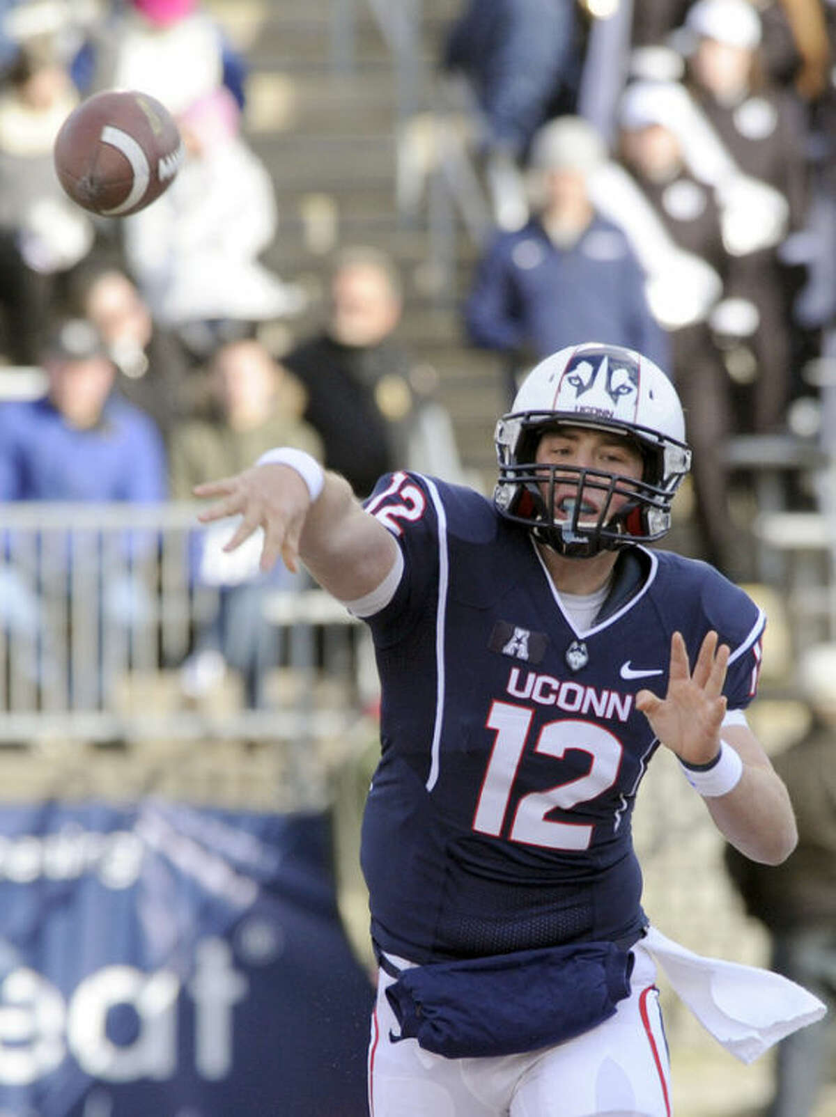 Connecticut quarterback Casey Cochran (12) passes during the first half of an NCAA college football game against Memphis, in East Hartford, Conn., on Saturday, Dec. 7, 2013. (AP Photo/Fred Beckham)