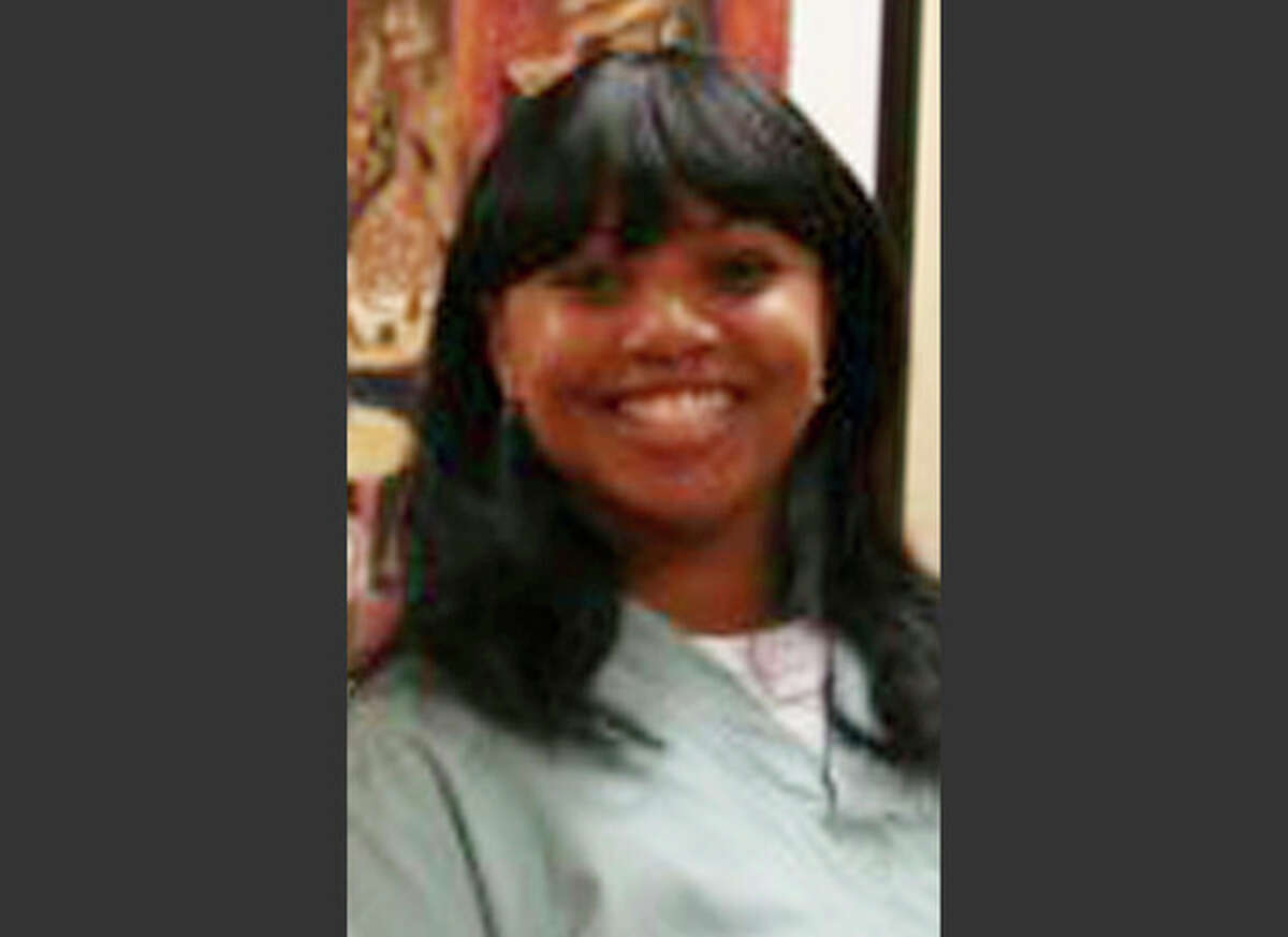 FILE - This 2011 photo provided by Dr. Barry Weiss, from the website of Advanced Periodontics in Hamden, Conn., shows former employee Miriam Carey. The 34-year-old Carey, who was shot to death after a car chase outside the U.S. Capitol this month, had been under delusions that government cameras kept her under constant surveillance, and her boyfriend contacted police several times to express concerns about the safety of their daughter, according to records released Thursday, Oct. 24, 2013. (AP Photo/Advanced Periodontics, File)