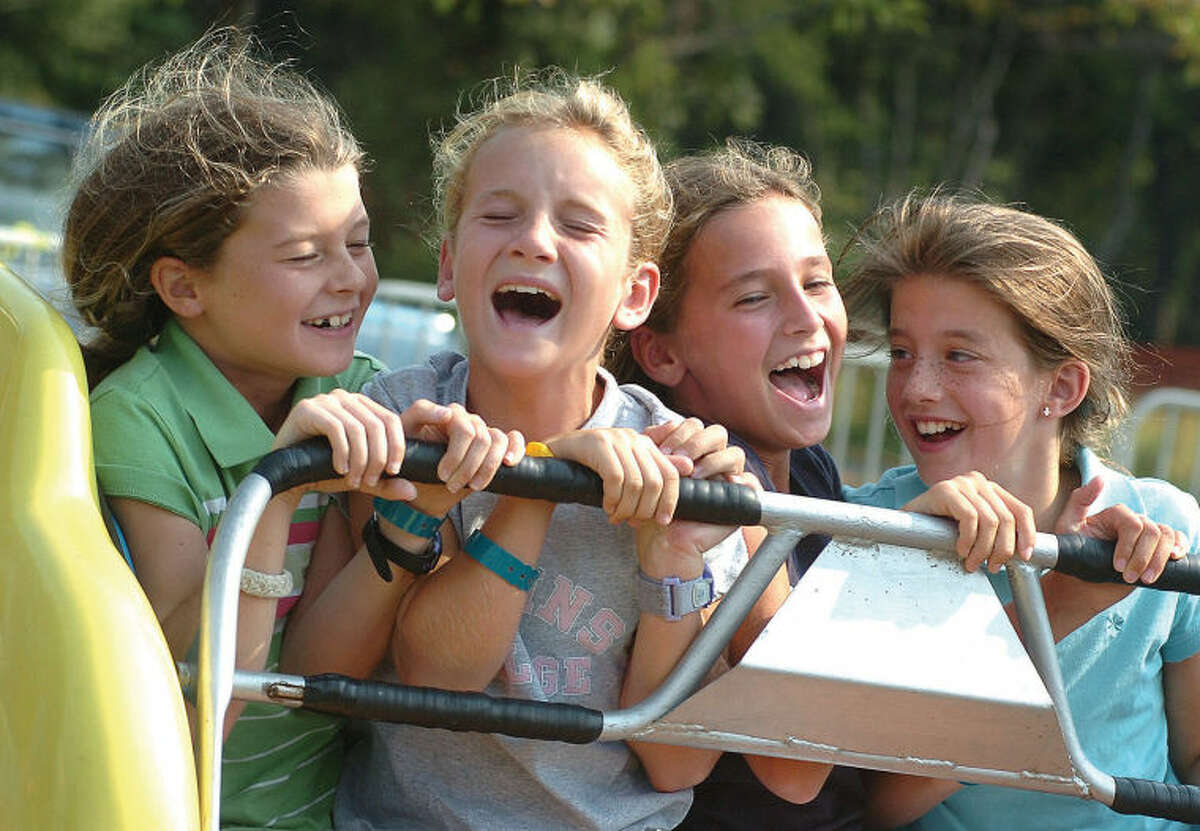 L-R Cait Callahan , Christy Smith, Brooke Connolly and Kailey Zengo all 5th grade 10 yr olds ride the scrambler at the Rotary carnival on Saturday photo;alex von kleydorff file-09-15-06