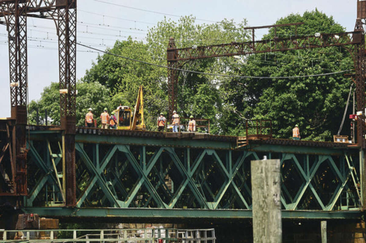 Hour photo / Erik Trautmann Metro-North Railroad and CT DOT give local media a tour of the inner workings of the 118-year-old Walk train bridge in Norwalk Wednesday.