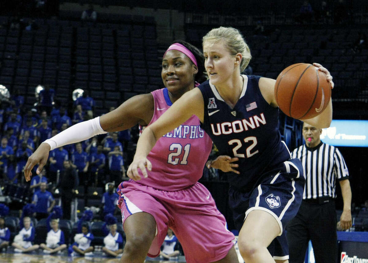 Connecticut's Tierney Lawlor (22) drives past Memphis' Asianna Fuqua-Bey (21) in the second half of an NCAA college basketball game Saturday, Feb. 7, 2015, in Memphis, Tenn. (AP Photo/Karen Pulfer Focht)