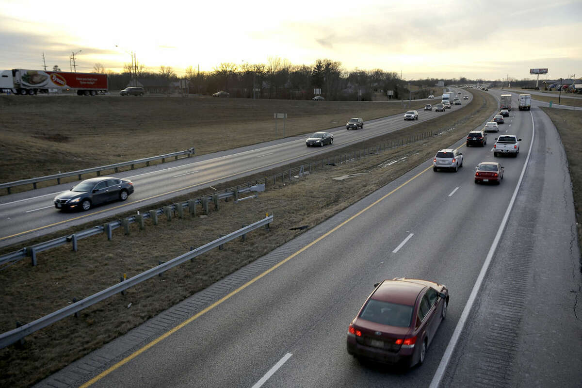 ADVANCE FOR SATURDAY, FEB. 21, 2015, AND THEREAFTER - In this Thursday, Feb. 12, 2015 photo, vehicles travel along Interstate 70 in Foristell, Mo. Built in the 1950s and 60s with a life expectancy of 20 years, a 200-mile span of the four-lane interstate between suburban St. Louis and Kansas City is crumbling beneath its surface as it carries more than 30,000 vehicles a day on many of its rural stretches. (AP Photo/Jeff Roberson)